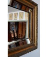 Miroir biseauté ancien avec encadrement en bois doré